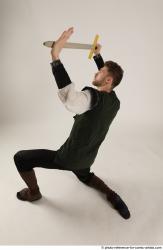 KEETA KNEELING POSE WITH SWORD